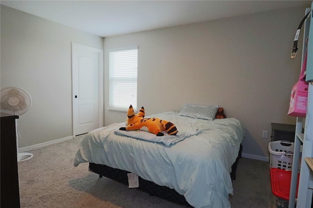 carpeted bedroom with baseboards