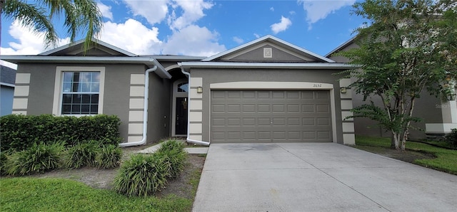 ranch-style home featuring a garage