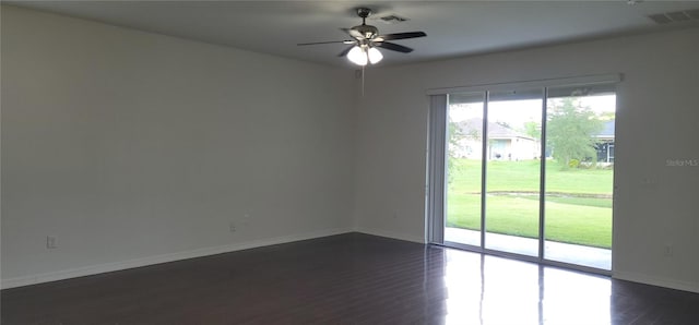 unfurnished room with dark hardwood / wood-style floors and ceiling fan