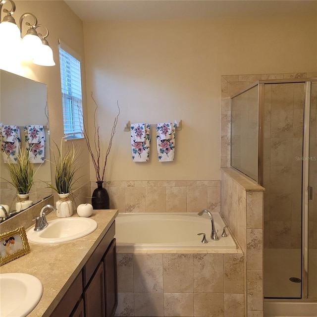 bathroom featuring vanity and separate shower and tub