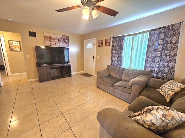 living room with light tile patterned flooring and ceiling fan