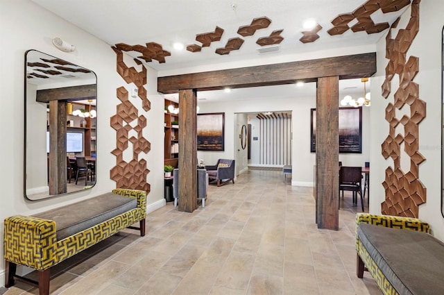 interior space featuring an inviting chandelier and light tile patterned floors