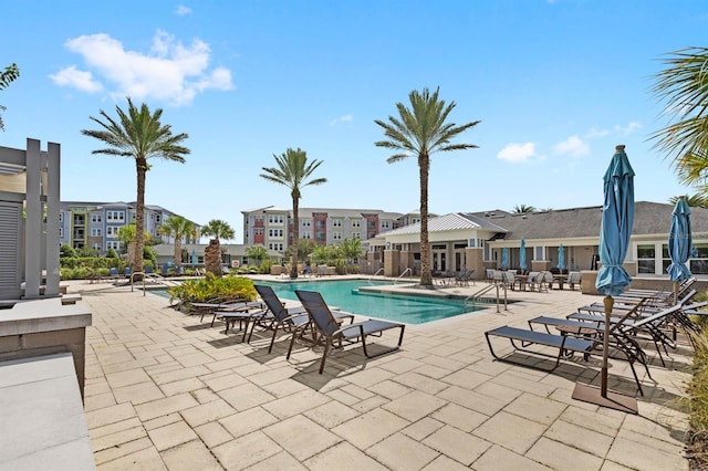 view of swimming pool featuring a patio