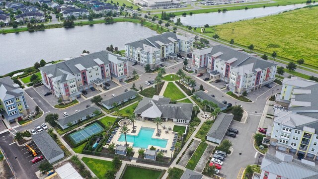 birds eye view of property featuring a water view