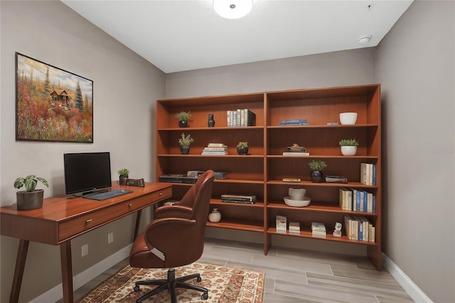 office space with baseboards