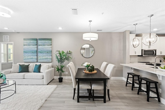 7573 Laureate Blvd Unit 1301, Orlando, FL 32827 - living area with baseboards, recessed lighting, and light wood-type flooring