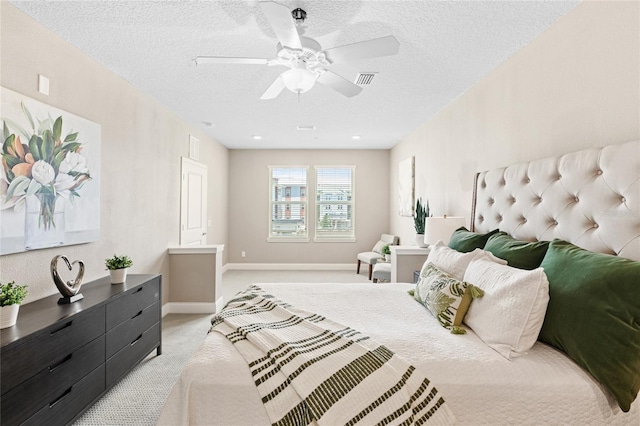 7573 Laureate Blvd Unit 1301, Orlando, FL 32827 - bedroom with a textured ceiling, light carpet, a ceiling fan, and baseboards