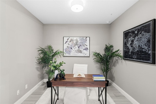 7573 Laureate Blvd Unit 1301, Orlando, FL 32827 - office area with baseboards and light wood finished floors