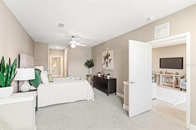 7573 Laureate Blvd Unit 1301, Orlando, FL 32827 - bedroom with light carpet, baseboards, and ceiling fan