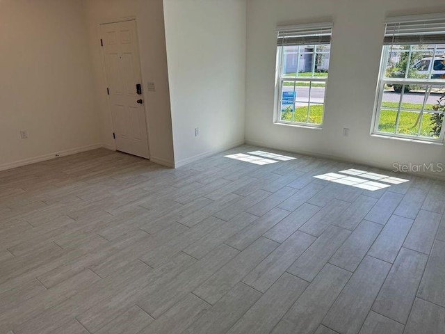 spare room featuring light wood-type flooring