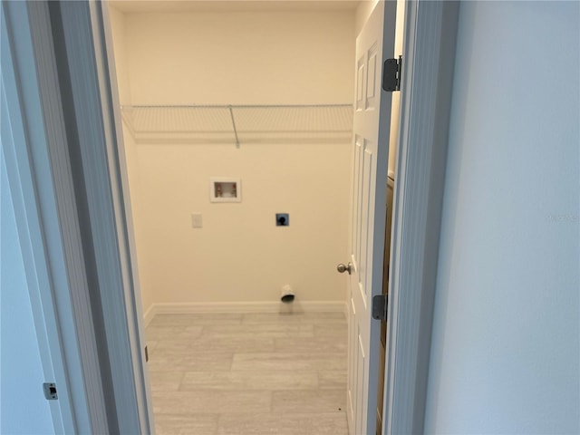 laundry room featuring light hardwood / wood-style floors, washer hookup, and hookup for an electric dryer