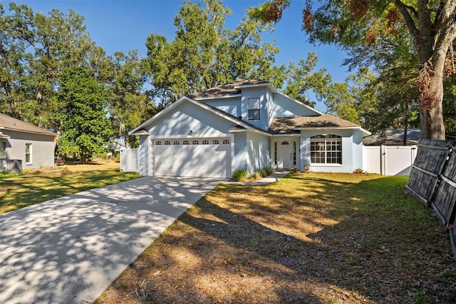 view of front of home featuring a garage and a front yard