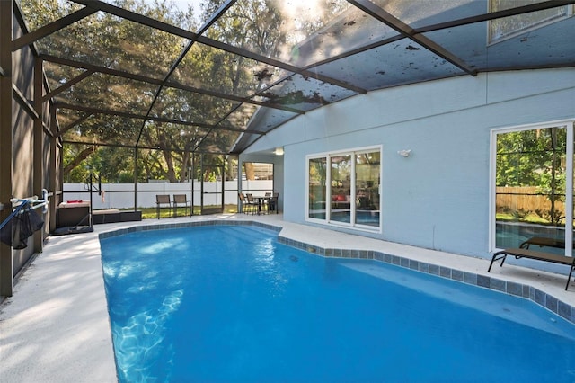 view of pool with a lanai and a patio area