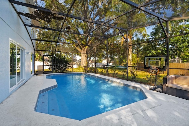 view of swimming pool with a patio and a lanai