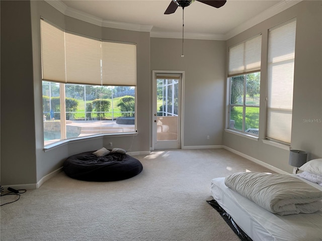 sitting room with a wealth of natural light, carpet floors, and ceiling fan