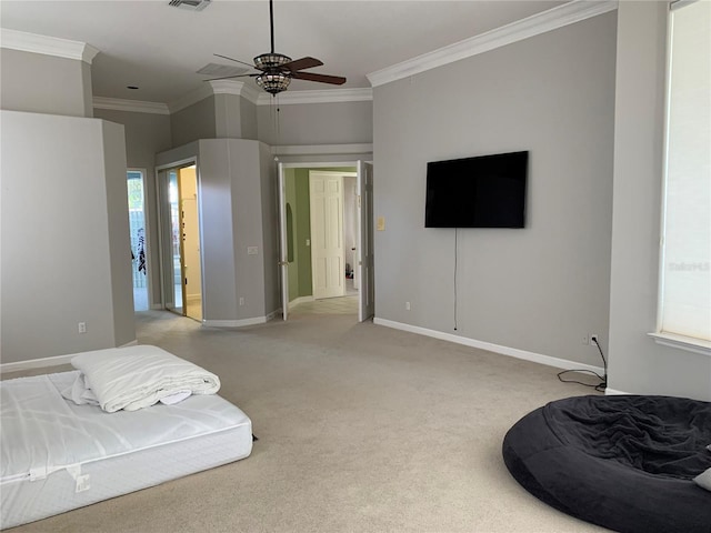 bedroom with ceiling fan, ornamental molding, and light carpet