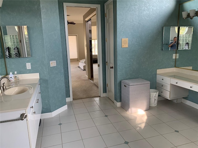 bathroom featuring tile patterned flooring and vanity