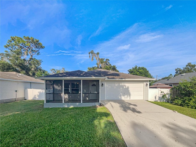 single story home with a front lawn, a garage, and a sunroom