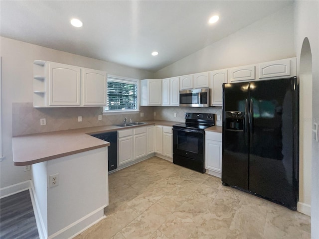 kitchen featuring sink, decorative backsplash, vaulted ceiling, kitchen peninsula, and black appliances