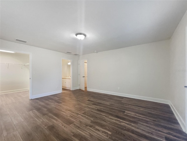 unfurnished room with wood-type flooring