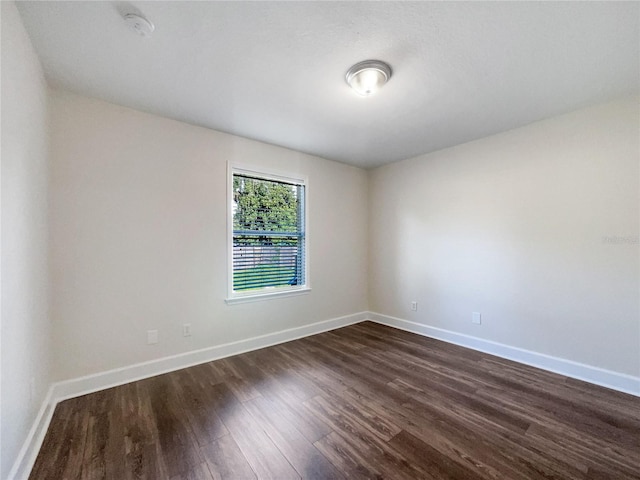 empty room featuring dark hardwood / wood-style floors