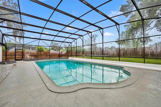 view of pool with a lanai, a patio area, fence, and a fenced in pool