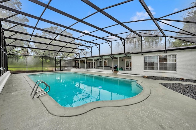 pool featuring a lanai and a patio