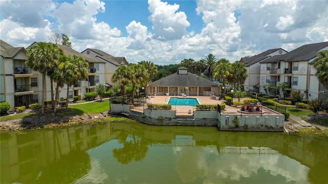 1932 Lake Atriums Cir Unit 86, Orlando, FL 32839 - exterior space featuring a patio area, a water view, a community pool, and a residential view