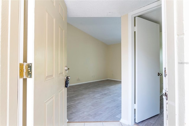1932 Lake Atriums Cir Unit 86, Orlando, FL 32839 - hallway with wood finished floors and baseboards