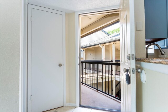 1932 Lake Atriums Cir Unit 86, Orlando, FL 32839 - entryway featuring a sink and light tile patterned flooring