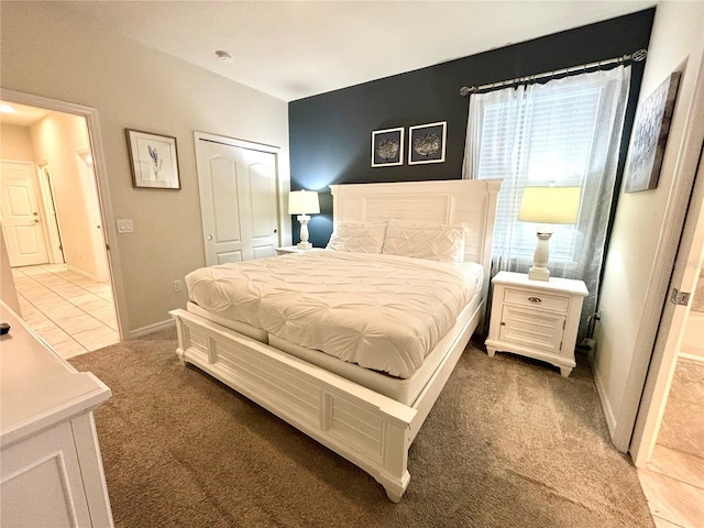 carpeted bedroom featuring a closet