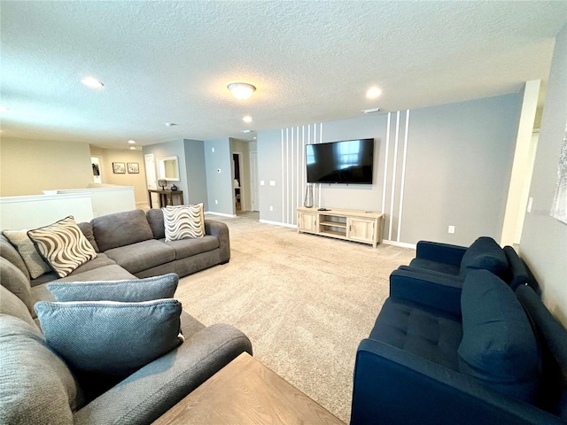 living room featuring light colored carpet and a textured ceiling