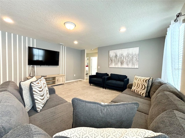 living room with light carpet and a textured ceiling