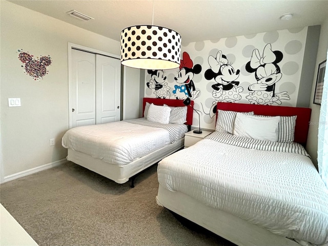 carpeted bedroom with a closet