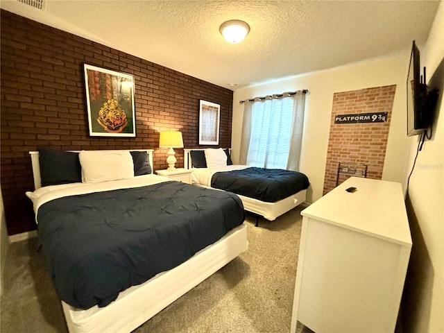 carpeted bedroom featuring a textured ceiling and brick wall