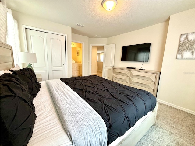 carpeted bedroom with a closet