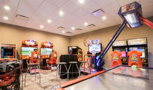 game room featuring a drop ceiling