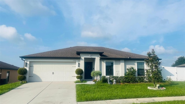 view of front of house featuring a garage, central air condition unit, and a front lawn