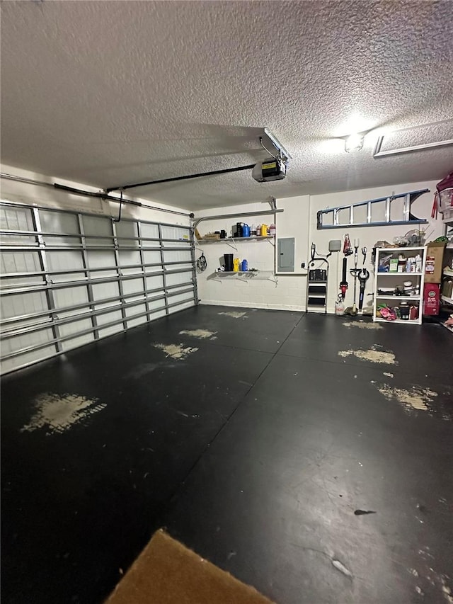 garage featuring electric panel and a garage door opener