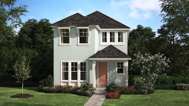 traditional home featuring a shingled roof, a front lawn, and stucco siding