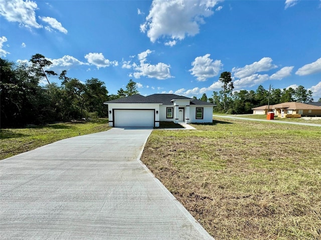 ranch-style house featuring a garage and a front lawn