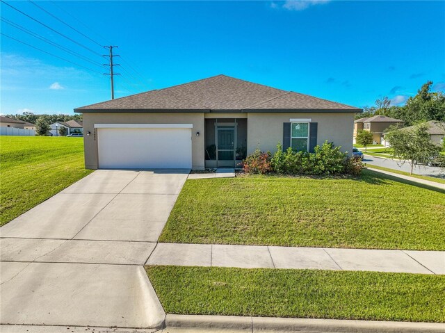 view of front facade with a garage and a front yard