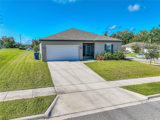 view of front of property featuring a front yard and a garage