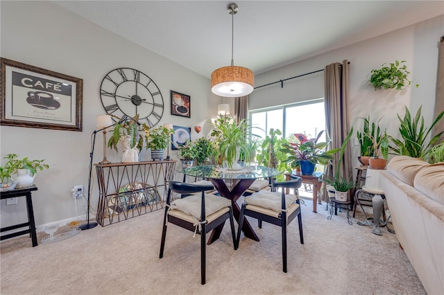 view of carpeted dining area