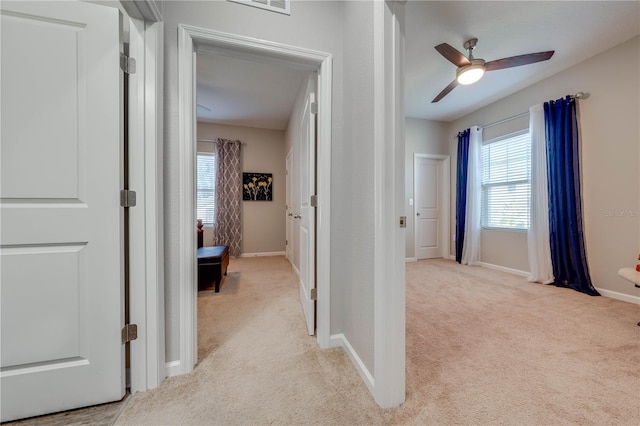 hallway with light carpet