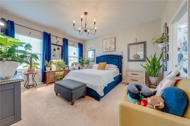 bedroom featuring light carpet and a notable chandelier