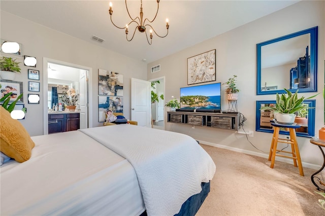 bedroom featuring ensuite bath, a chandelier, and carpet floors