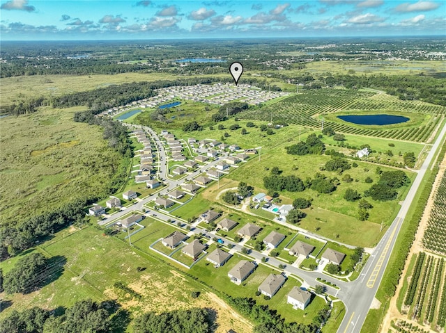 birds eye view of property with a rural view