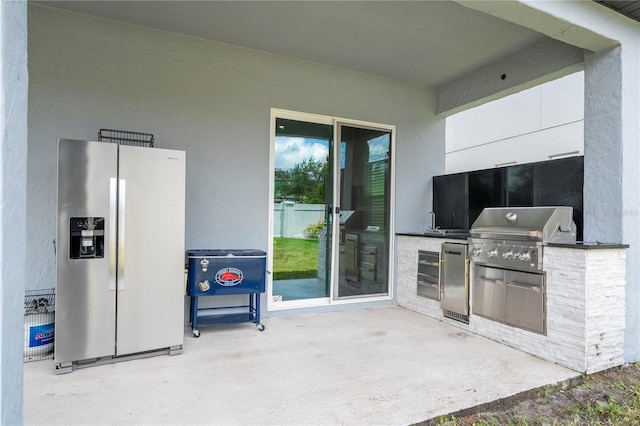 view of patio with grilling area and area for grilling