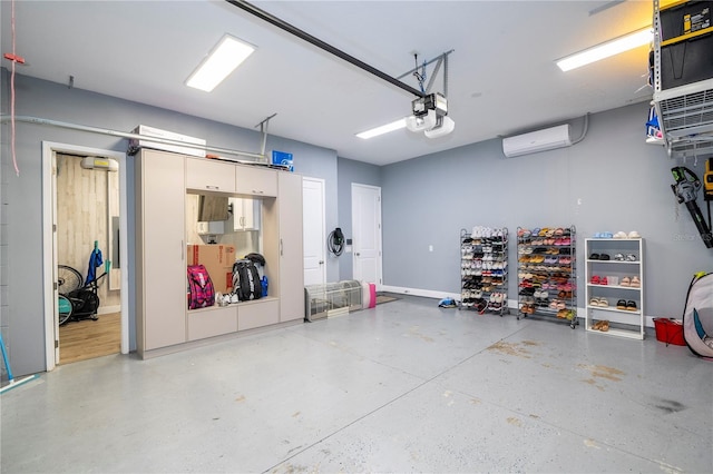 garage featuring a wall mounted air conditioner and a garage door opener